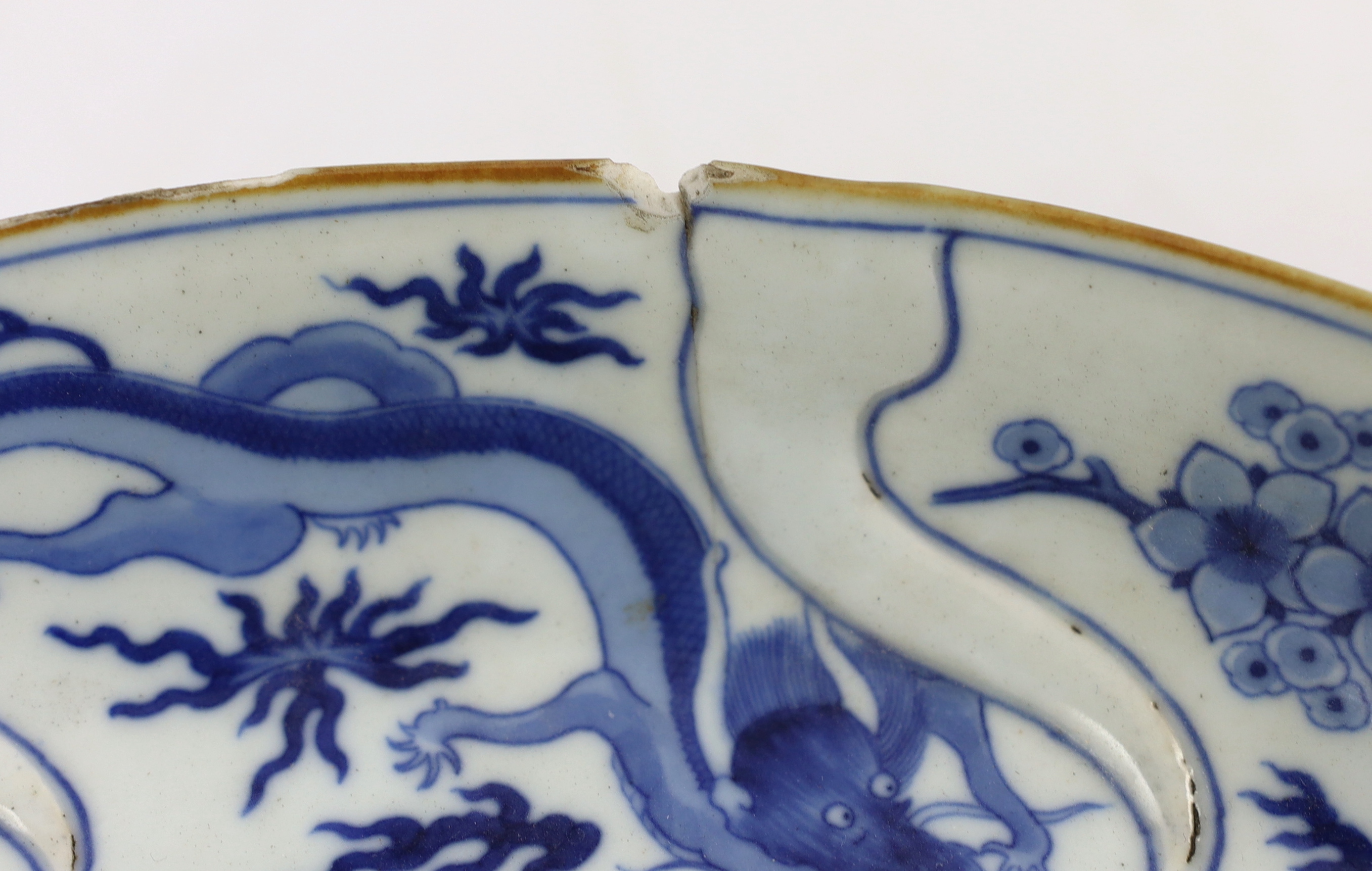 A pair of Chinese blue and white armorial dishes in Japanese Kakiemon style, Qianlong period, c.1752